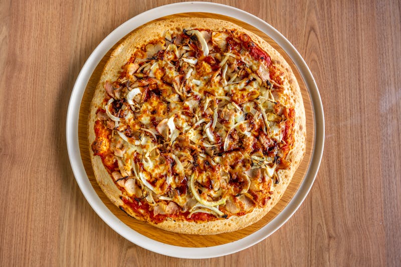 BBQ Chicken Inferno pizza with smoky chicken and jalapeños